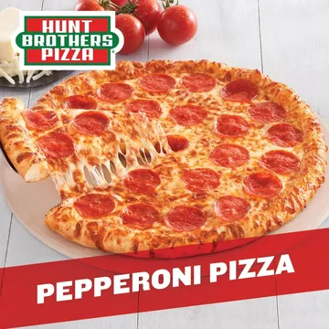 A pepperoni pizza with melted cheese is partially sliced, displayed on a table. The pizza is branded with Hunt Brothers Pizza and a red banner reads 'Pepperoni Pizza'.